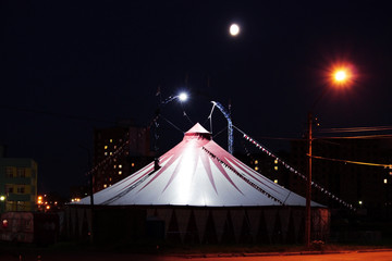 gloomy tent of terrible circus at night in the wasteland. © wolfness72