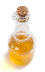food oil in bottle on white