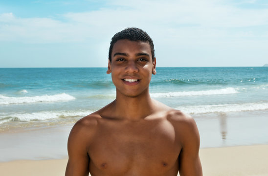 Laughing brazilian man at beach