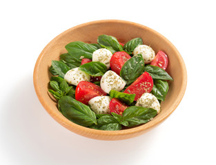 caprese salad in plate on white background