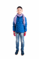 Young asian boy wearing blue jacket and scarf standing over white background