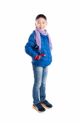 Fototapeta premium Young asian boy wearing blue jacket and scarf standing over white background