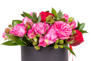 Close up of lovely bouquet of pink and red roses isolated on white background