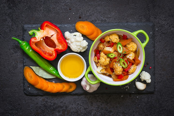 bowl of stewed vegetables ragout and raw ingredients. Healthy, Vegetarian Food Concept