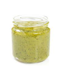 pesto sauce in jar on white background