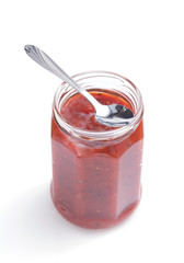 tomato sauce in glass jar on white