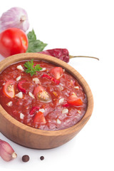 tomato sauce in gravy boat on white