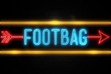 Obraz premium Footbag - fluorescent Neon Sign on brickwall Front view