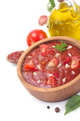 tomato sauce in gravy boat on white
