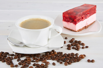 Cup of coffee and raspberry cheesecake with jelly. 
