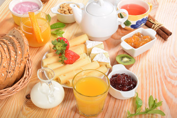 Bread with grains, yogurt, blueberries, strawberries and cheeses