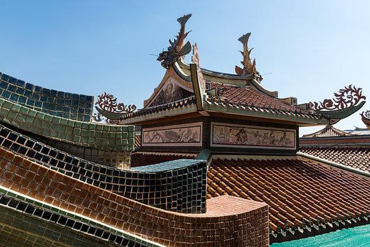 Chinese temple roof and Chinese art on top.