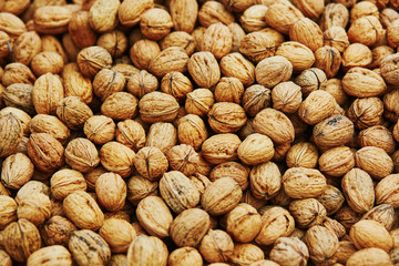 Large heap of walnuts on market