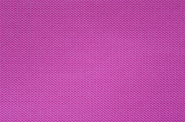 Fine texture of pink synthetic fabric. Macro picture of texture fabric showing its structure