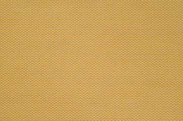 Fine texture of orange synthetic fabric. Macro picture of texture fabric showing its structure