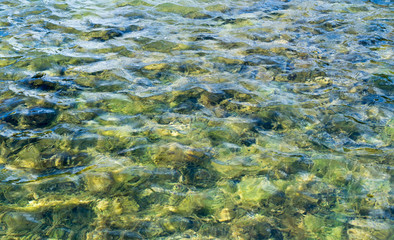 Fototapeta na wymiar texture of water in tiled pool, fountain. background, nature.