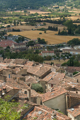 Fototapeta na wymiar The picturesque view on the tile roofs of the houses of Fayence village in Cote d’Azur, Provence, France