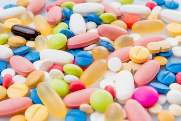 Fototapeta na wymiar Colorful pills. Medical or vitamin pills. Colorful medicine pills as texture. Pill pattern background