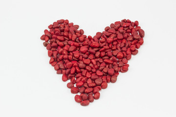 Fototapeta na wymiar A heart, made by red stones.