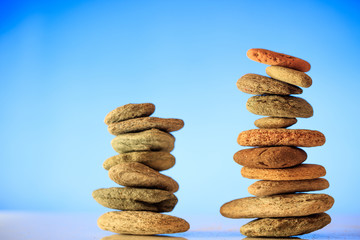 Zen stones stacks on blue background
