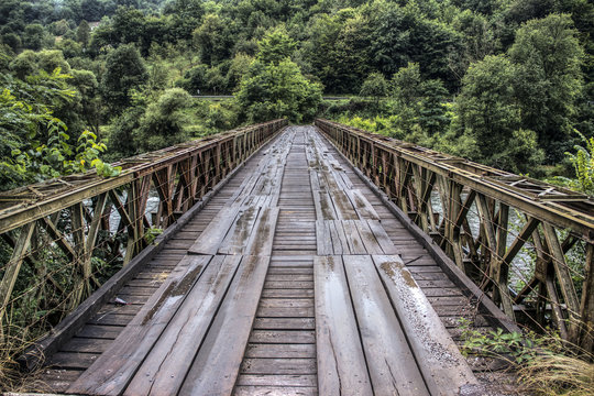 An old bridge spanning the mountain river