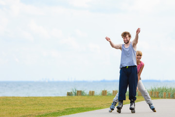 roller skater couple skating outdoor