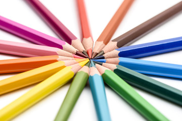 Naklejka premium Colored pencils on white background