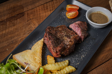 Buffalo meat steak on wood