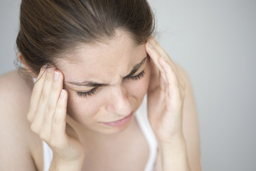 Fototapeta premium Young woman with headache