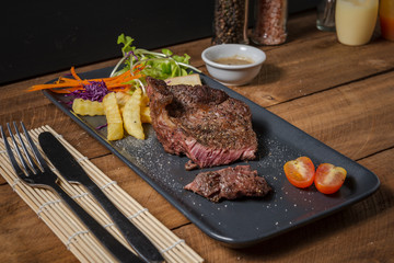 Buffalo meat steak on wood