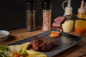 Buffalo meat steak on wood