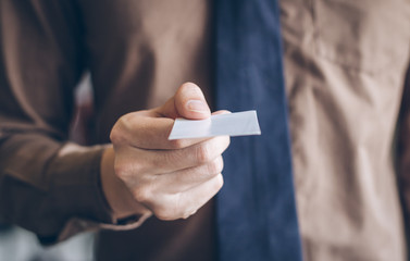 Close up businessman give business card for customer.