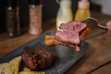 Buffalo meat steak on wood