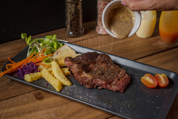 Buffalo meat steak on wood