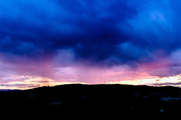 Dramatic sunset over Oslo after rain.