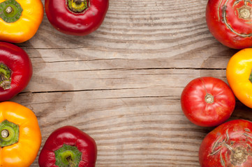 vegetables crop  on wooden background tomatoes sweet pepper, top view, frame, copy space