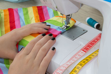 designer making a garment in her workplace