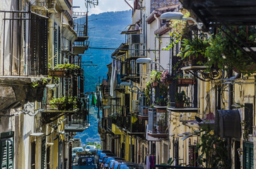 street with balconies and slope of the city of monreale