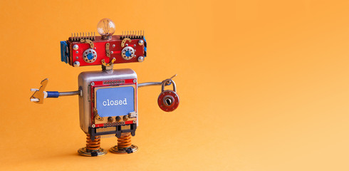 Friendly robot toy with key padlock on orange background. Cyborg smiley face, red head blue monitor body. digital message locked. copy space