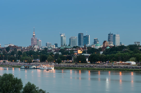 Evening panorama of Warsaw Vistula river waterfront and downtown skyline