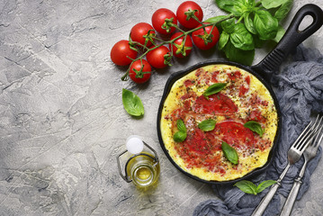 Omelet with tomato.Top view with copy space.