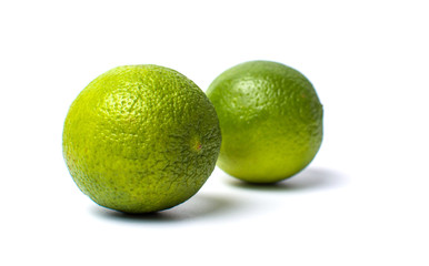 Green lime fruit isolated on white