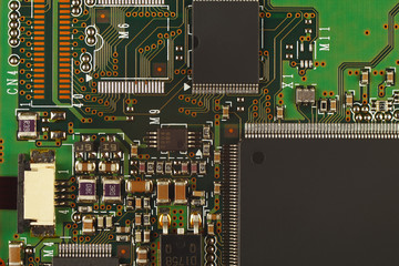 Microelectronic circuit board from a digital device close up.