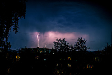 Thunderstorm and lightning in the city