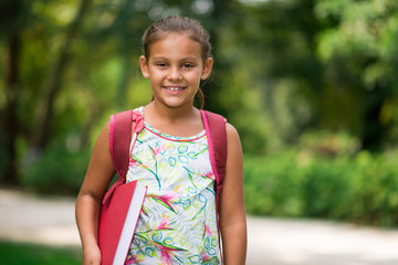 Smiling girl going to school