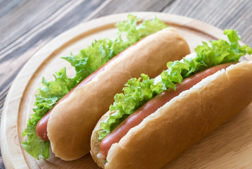 Hot dogs on the wooden board