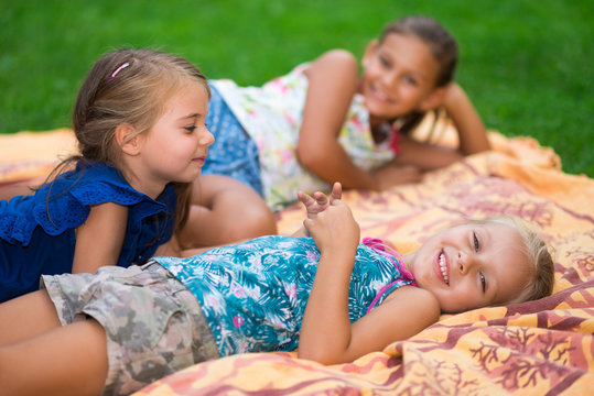 Happy little girls having fun in a park