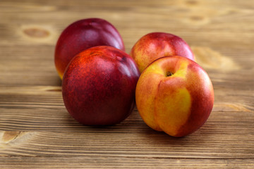 Fototapeta na wymiar peaches on a wooden background