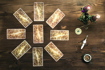 Tarot cards on wooden table. Fortune teller table..