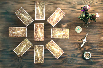 Tarot cards on wooden table. Fortune teller table..